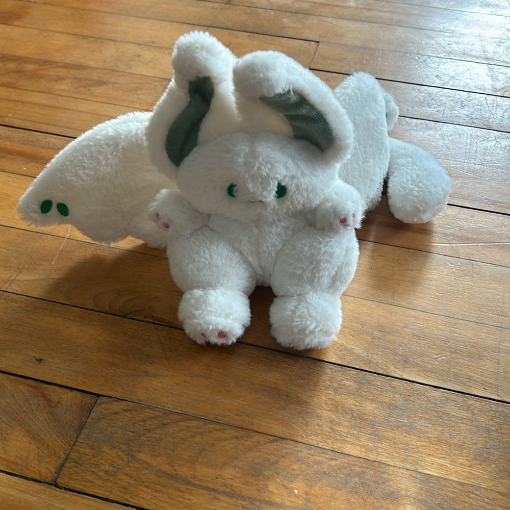 White and green stuffed animal